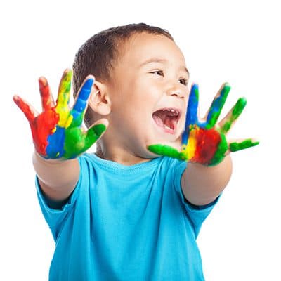 A happy child with painted hands