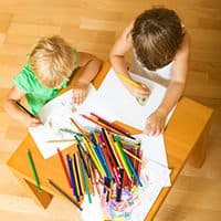 Children drawing with colored pencils